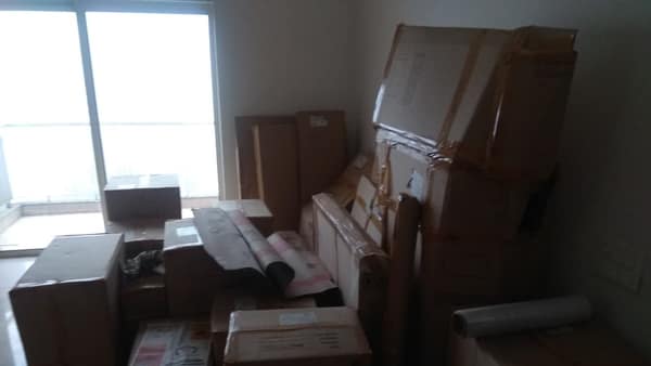 Packed boxes and furniture in an apartment before a move
