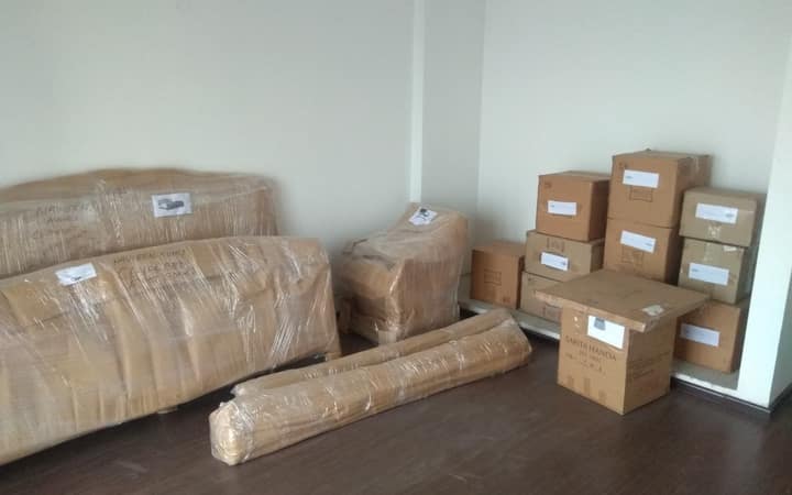 Furniture and labelled cartons packed and ready for an intercity move
