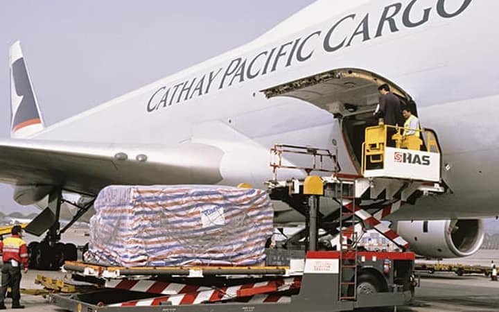 Wrapped consignment being loaded into a cargo aircraft